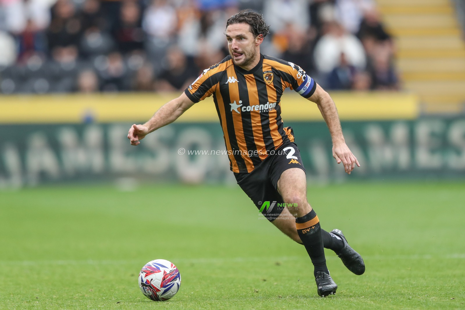 Lewis Coyle of Hull City breaks with the ball during the Sky Bet Championship match Hull City vs Millwall at MKM Stadium, Hull, United Kingdom, 24th August 2024

(Photo by Alfie Cosgrove/News Images)