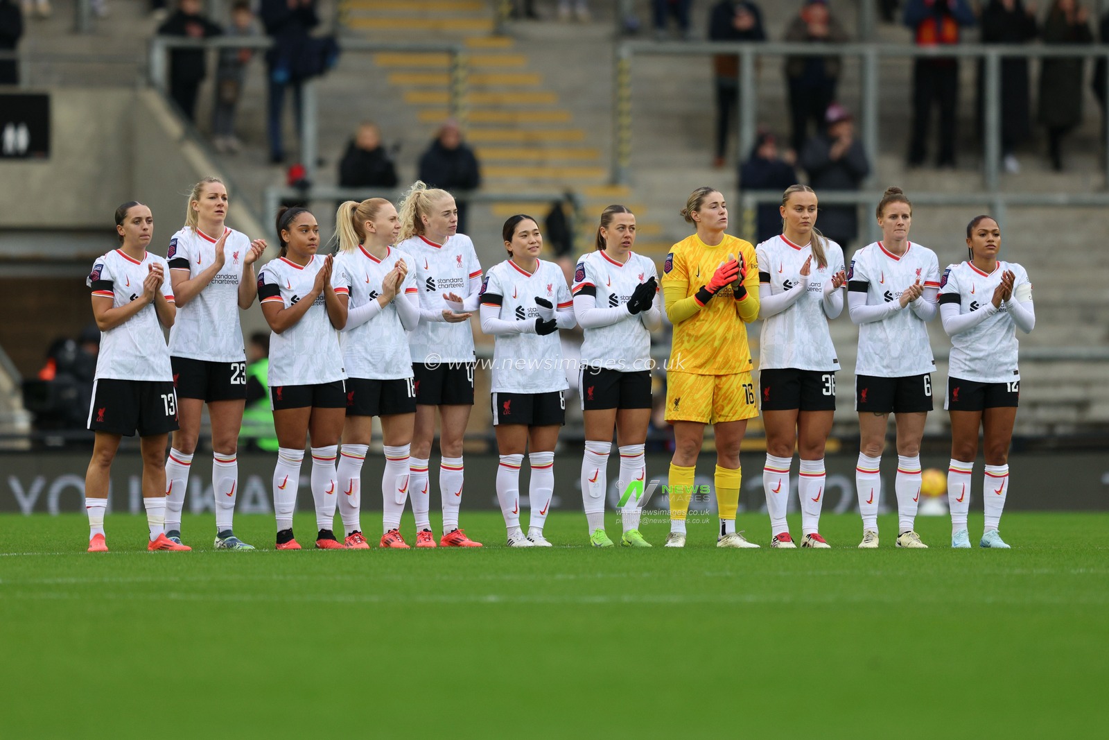 Liverpool players take part in a minutes silence for Kath Phipps during the Barclays Women's Super League match Manchester United Women vs Liverpool Women at Leigh Sports Village, Leigh, United Kingdom, 8th December 2024

(Photo by Alex Roebuck/News Images)