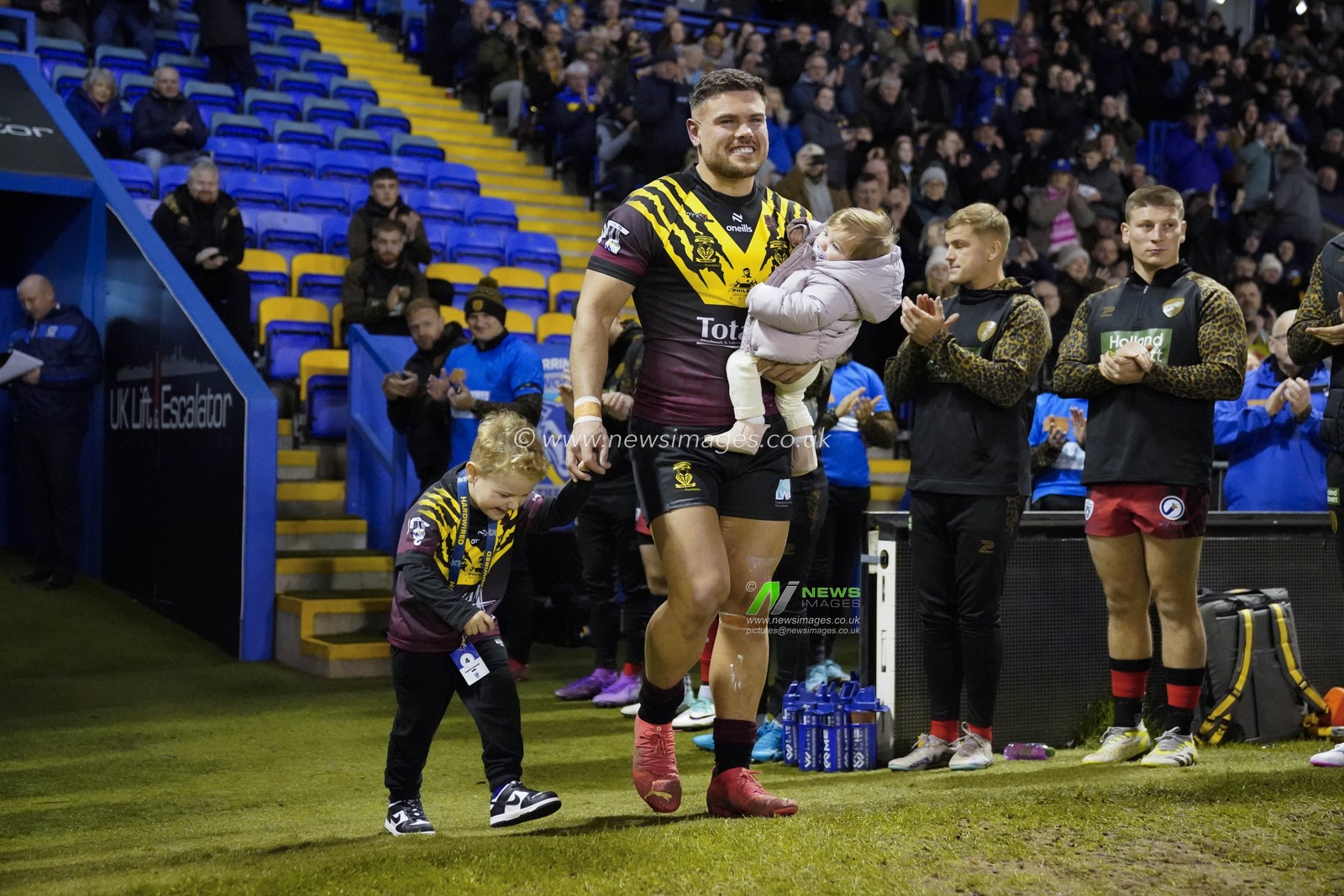 Joe Philbin of Warrington Wolves walks out with his children before the Rugby League Joe Philbin Testimonial match Warrington Wolves vs Leigh Leopards at Halliwell Jones Stadium, Warrington, United Kingdom, 3rd February 2024

(Photo by Steve Flynn/News Images)
