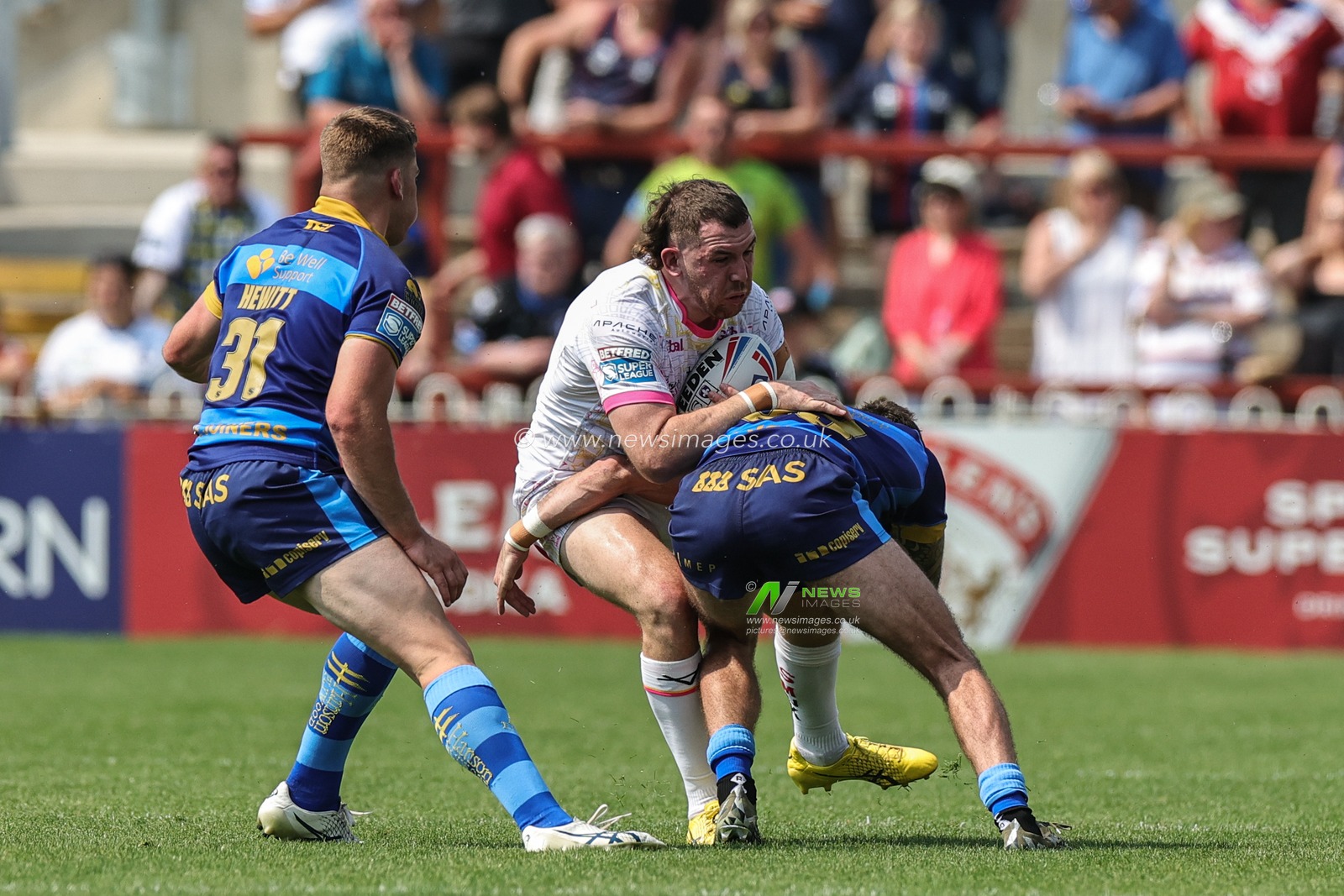 Cameron Smith #13 of Leeds Rhinos is tackled during the Betfred Super League Round 15 match Wakefield Trinity vs Leeds Rhinos at The Be Well Support Stadium, Wakefield, United Kingdom, 11th June 2023

(Photo by Mark Cosgrove/News Images)