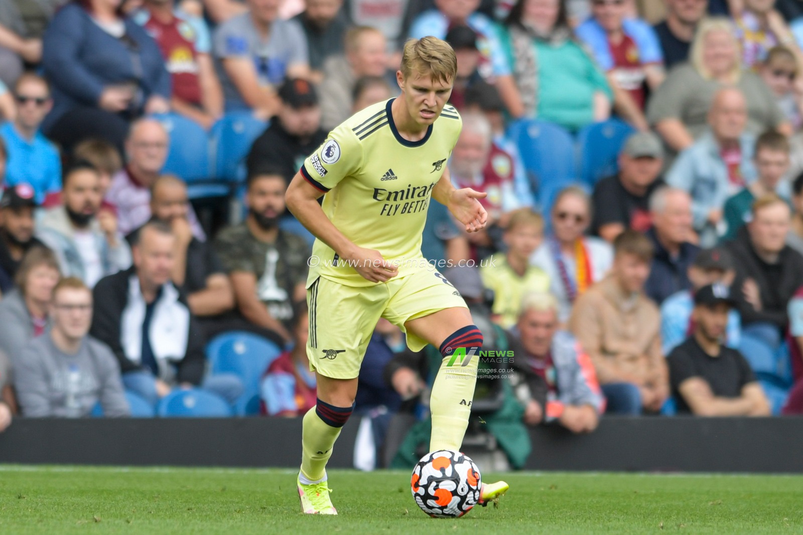 Martin Odegaard #8 of Arsenal runs forward with the ball