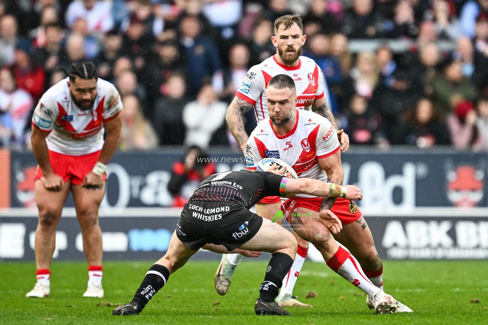 Curtis Sironen of St. Helens is tackled by Alex Smith of Wigan Warriors during the Betfred Super League Round 6 match St Helens vs Wigan Warriors at Totally Wicked Stadium, St Helens, United Kingdom, 29th March 2024

(Photo by Craig Thomas/News Images)