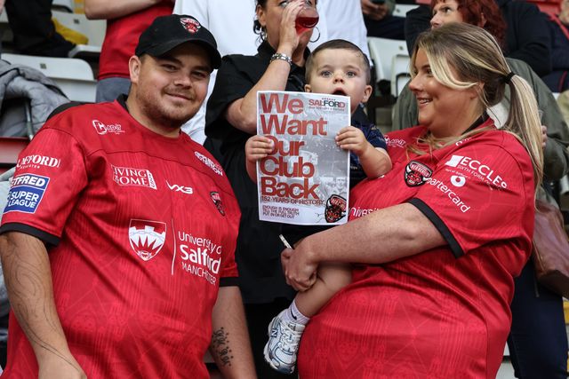 Salford Red Devils fans protest holding up a signs saying “We want out club back” during the Betfred Super League Round 23 match Leigh Leopards vs Salford Red Devils at Leigh Sports Village, Leigh, United Kingdom, 22nd August 2025

(Photo by Mark Cosgrove/News Images)