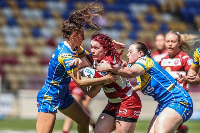 Eva Hunter of Wigan Warriors is tackled during the Betfred Women's Challenge Cup Cup Semi-final match Leeds Rhinos vs Wigan Warriors at LNER Community Stadium, York, United Kingdom, 10th May 2025

(Photo by Alfie Cosgrove/News Images)