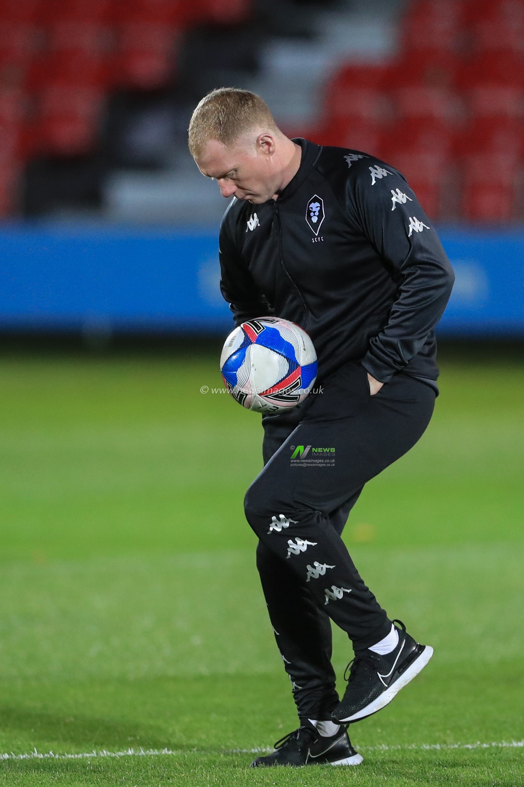 Paul Scholes manager of Salford City showing his skills by doing kick-ups during the pre-game warmup