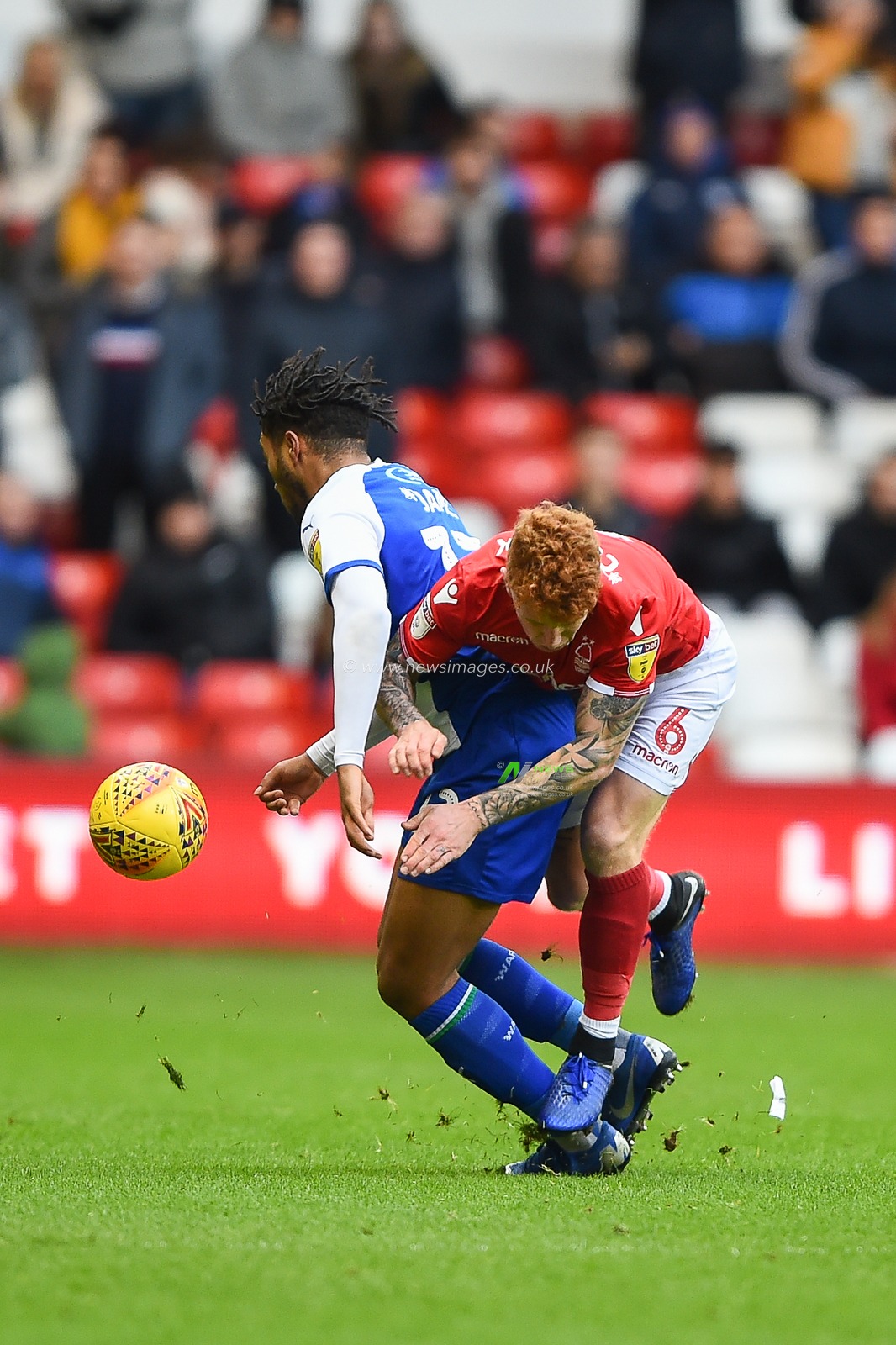 26th January 2019, City Ground, Nottingham, England ; Sky Bet Championship, Nottingham Forest v Wigan Athletic : Reece James (12) of Wigan collides with Jack Colback (6) of Nottingham Forest 

Credit: Jon Hobley/News Images

English Football League images are subject to DataCo Licence