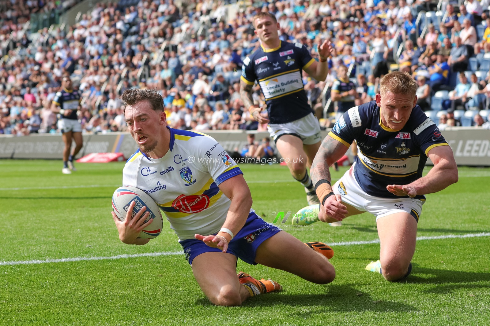 Matty Ashton #5 of Warrington Wolves goes over for a try and makes the score 6-8 in the first half of the Betfred Super League Round 22 match Leeds Rhinos vs Warrington Wolves at Headingley Stadium, Leeds, United Kingdom, 20th August 2023

(Photo by James Heaton/News Images)
