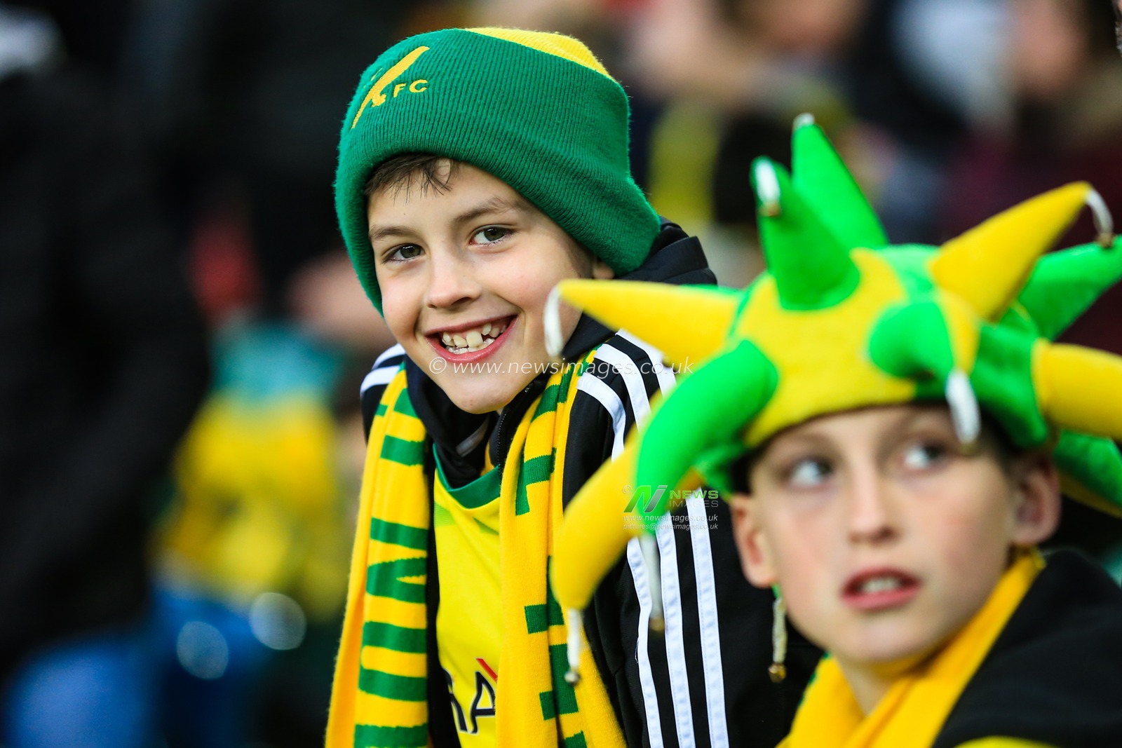 10th April 2019, Carrow Road, Norwich, England; Sky Bet Championship, Norwich City vs Reading ;  Two young Norwich fans look excited ahead of kick-off

Credit: Georgie Kerr/News Images

English Football League images are subject to DataCo Licence