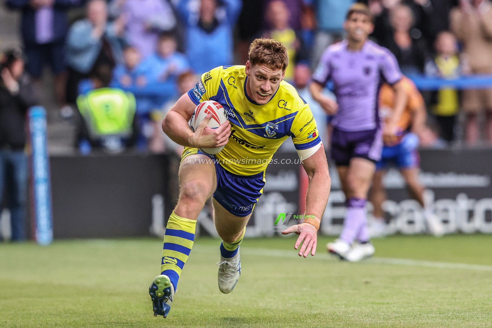 Dan Russell of Warrington Wolves goes over for a try during the Betfred Super League Round 12 match Warrington Wolves vs Hull KR at Halliwell Jones Stadium, Warrington, United Kingdom, 23rd May 2025

(Photo by Alfie Cosgrove/News Images)