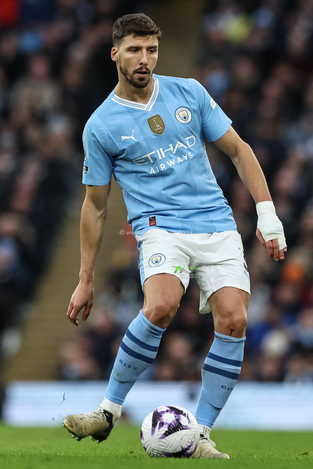 RÃºben Dias of Manchester City with the ball during the Premier League match Manchester City vs Manchester United at Etihad Stadium, Manchester, United Kingdom, 3rd March 2024

(Photo by Mark Cosgrove/News Images)