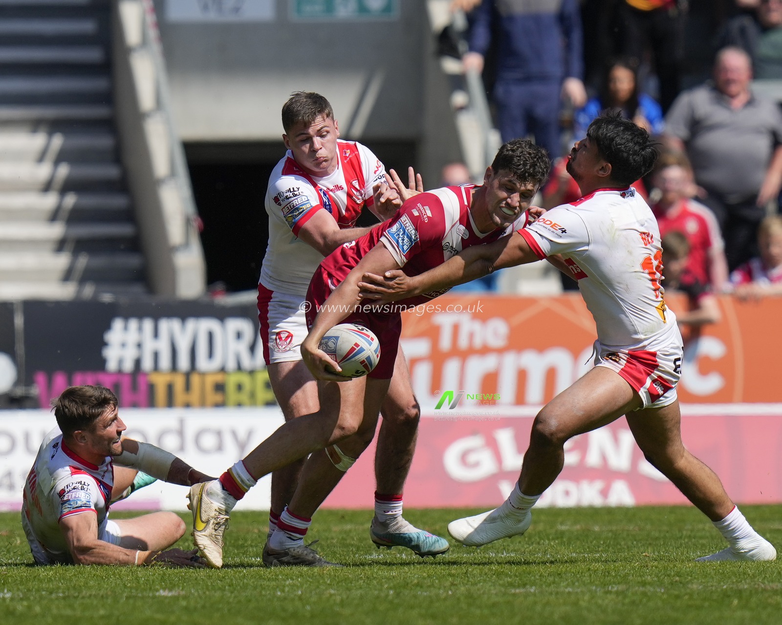 Sam Stone #12 of Salford Red Devils looks to off load the ball during the Betfred Super League Round 12 match St Helens vs Salford Red Devils at Totally Wicked Stadium, St Helens, United Kingdom, 13th May 2023

(Photo by Steve Flynn/News Images)
