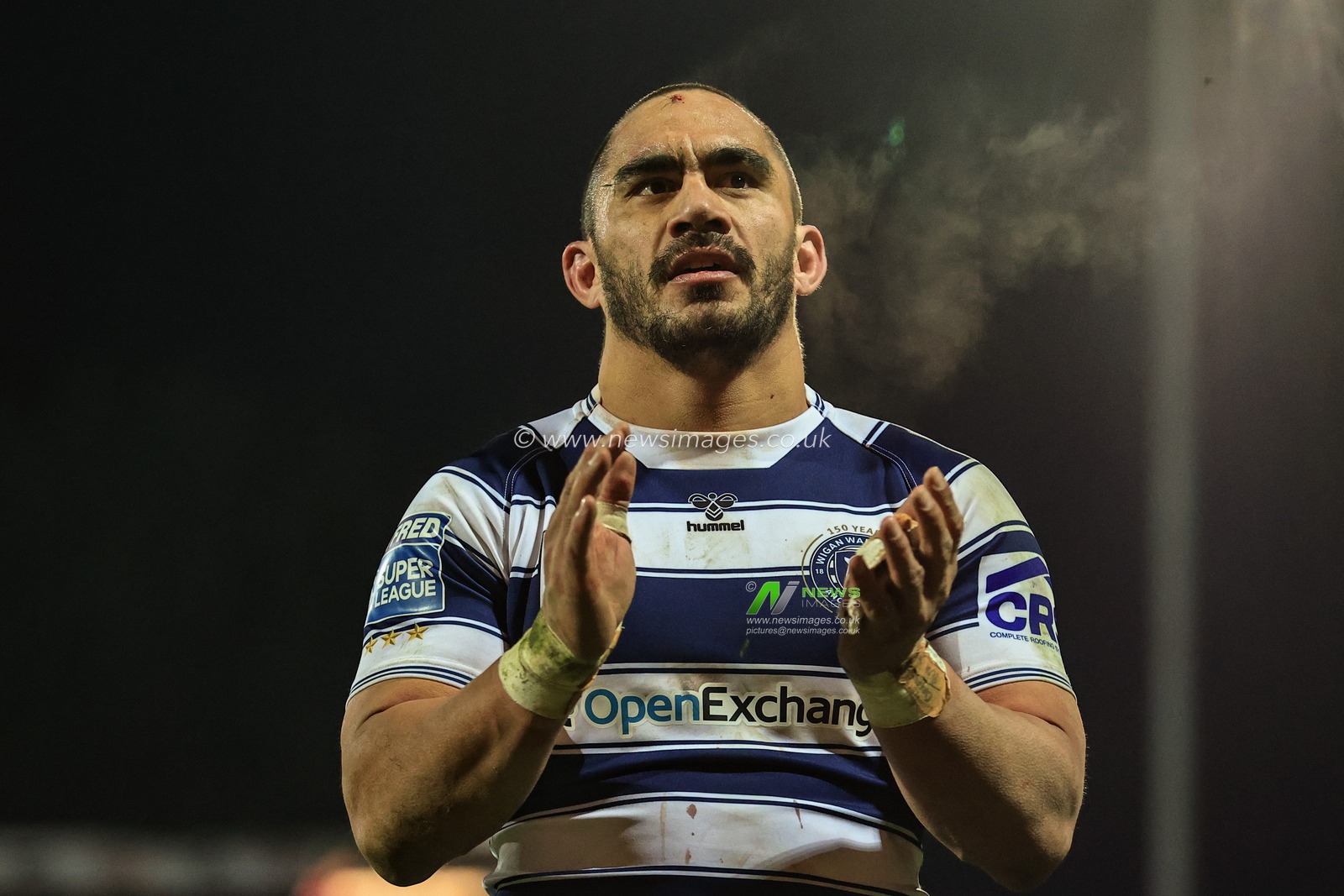 Thomas Leuluai #7 of Wigan Warriors applauds the traveling fans as Wigan win Hull KR 10-24