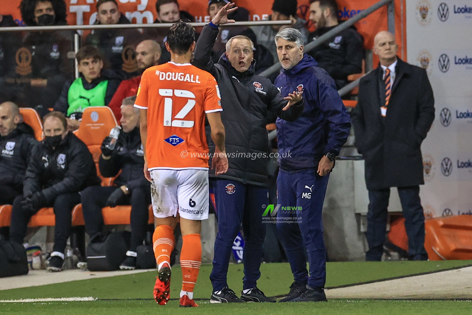 Neil Critchley Head Coach of Blackpool gives Kenny Dougall #12 of Blackpool instructions