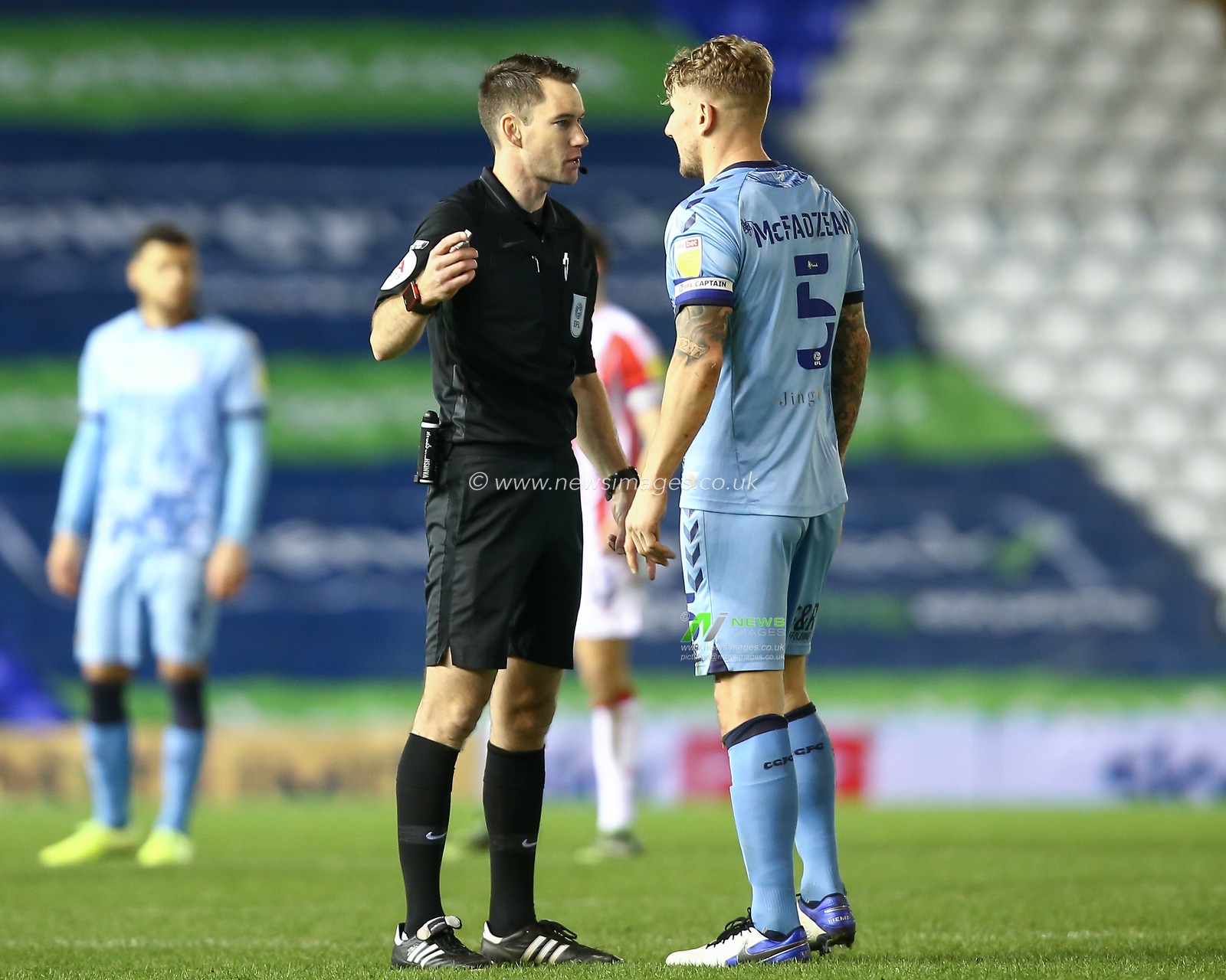 Kyle McFadzean #5 of Coventry City gets a talking to from the referee