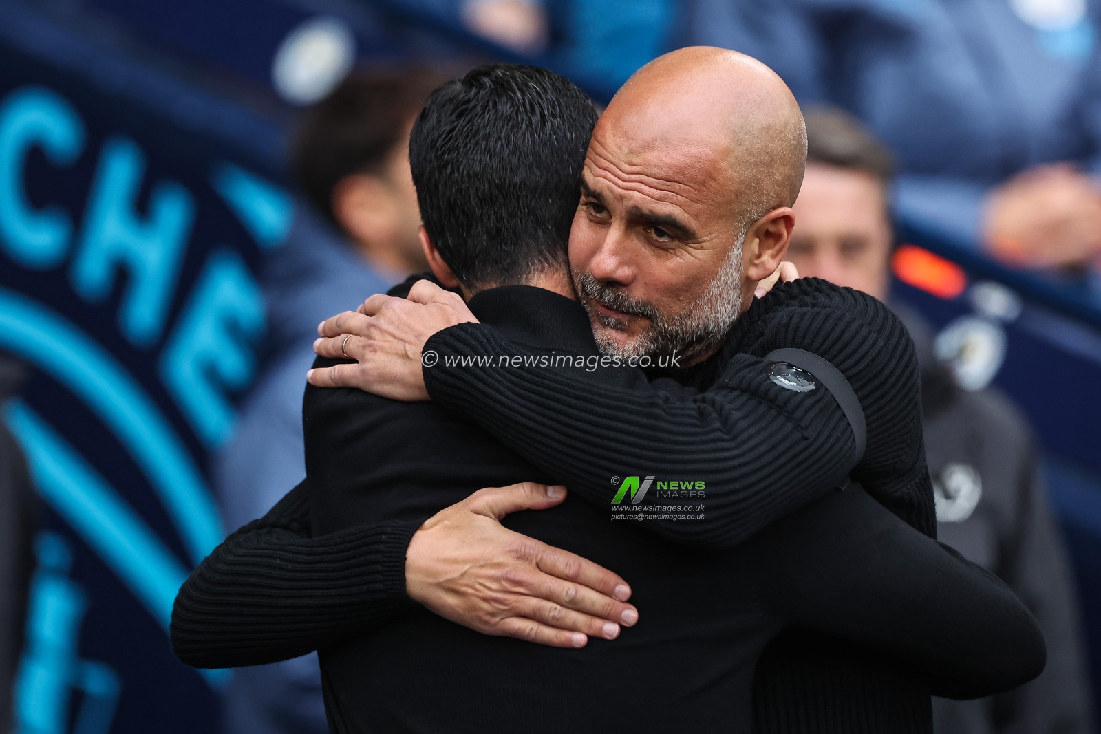 Mikel Arteta, Manager of Arsenal, embraces Josep Guardiola, Manager of Manchester City, ahead of the Premier League match Manchester City vs Arsenal at Etihad Stadium, Manchester, United Kingdom, 22nd September 2024

(Photo by Mark Cosgrove/News Images)
