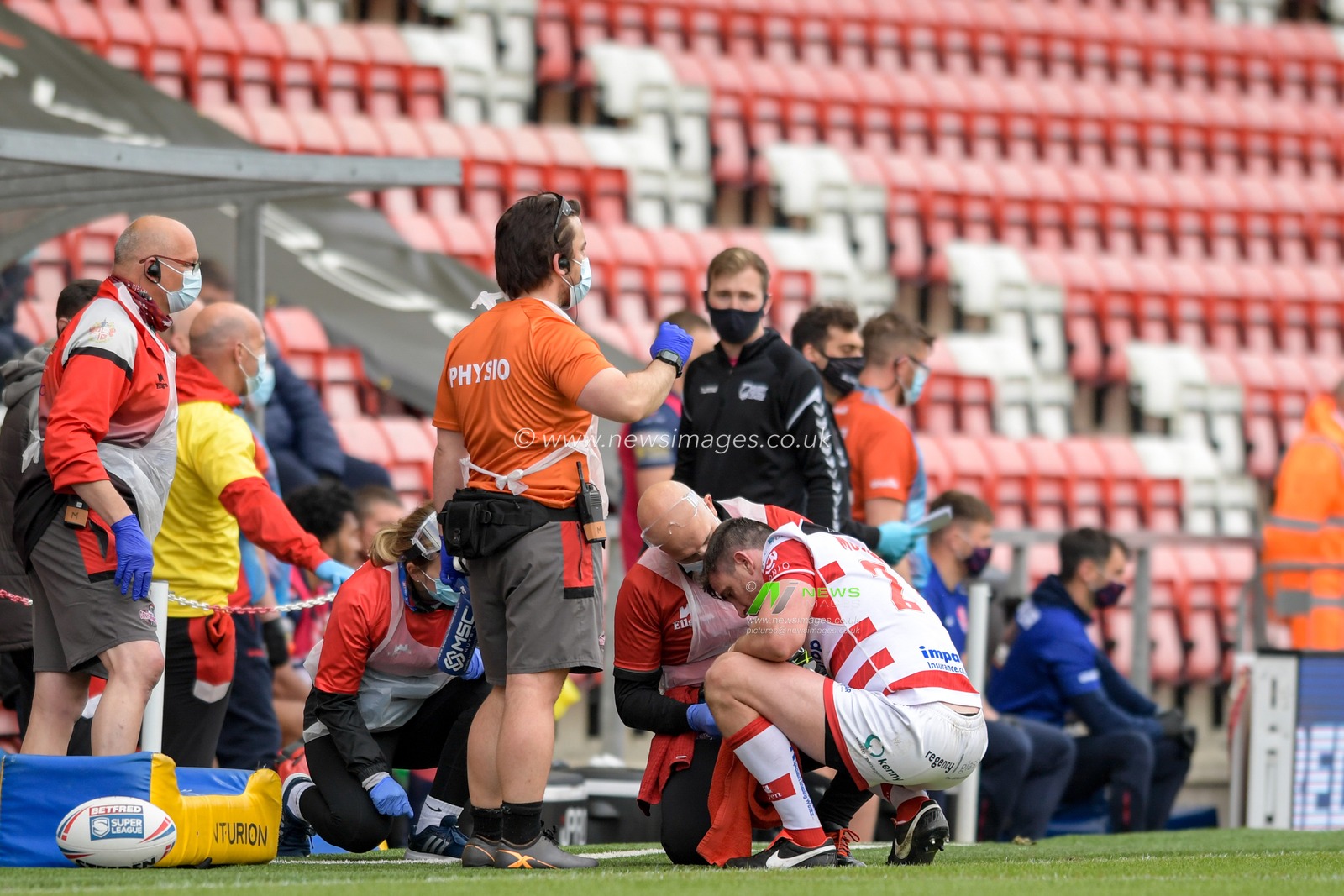 Tyrone McCarthy (21) of Leigh Centurions receives treatment on the pitch after an injury