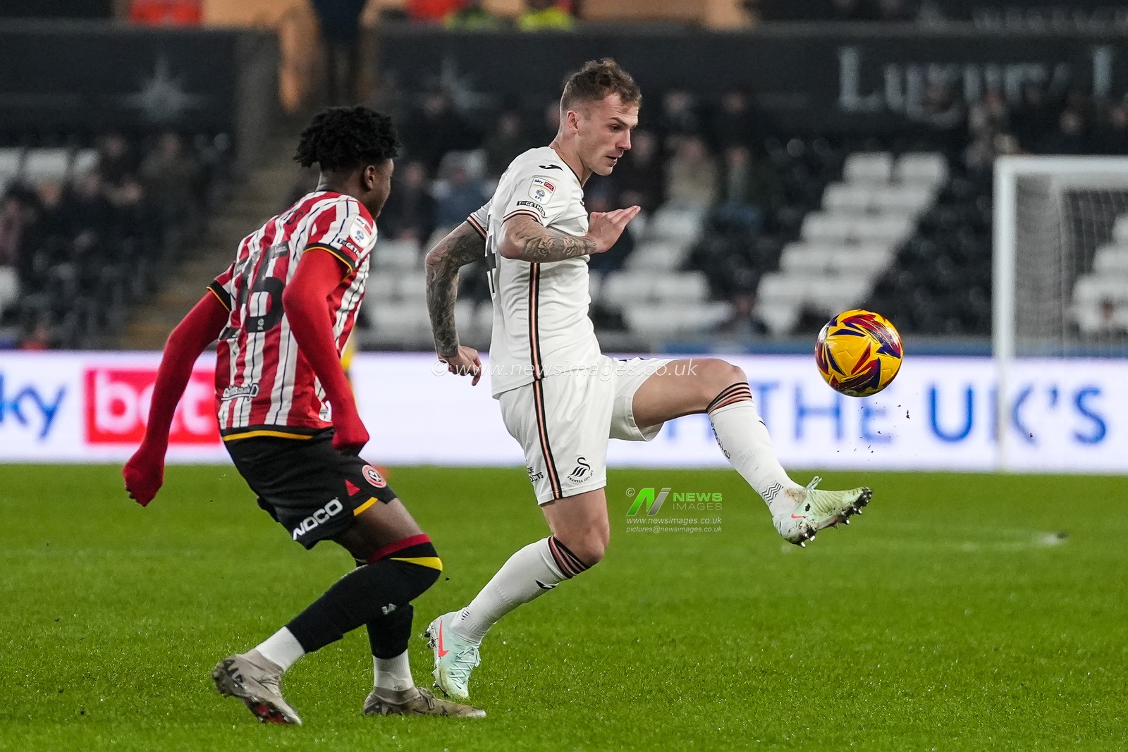 Josh Tymon of Swansea City passes the ball during the Sky Bet Championship match Swansea City vs Sheffield United at Swansea.com Stadium, Swansea, United Kingdom, 21st January 2025

(Photo by Andrew Lewis/News Images)