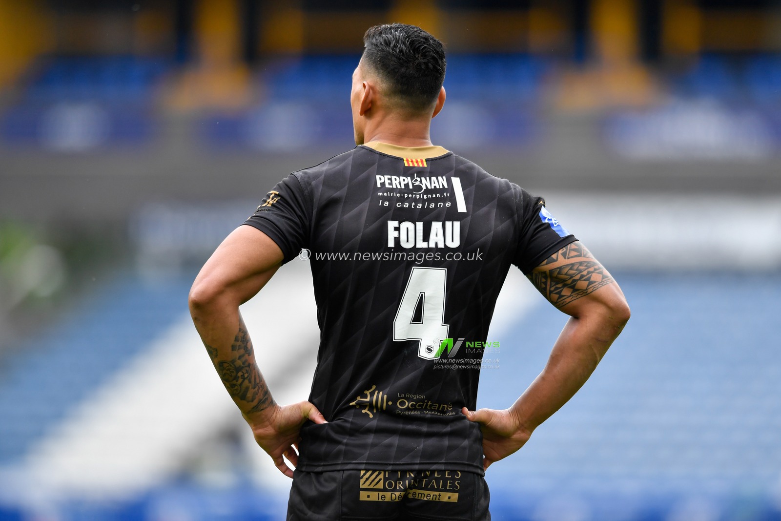 A rear view of Israel Folau (4) of Catalans Dragons with his hands on his hips