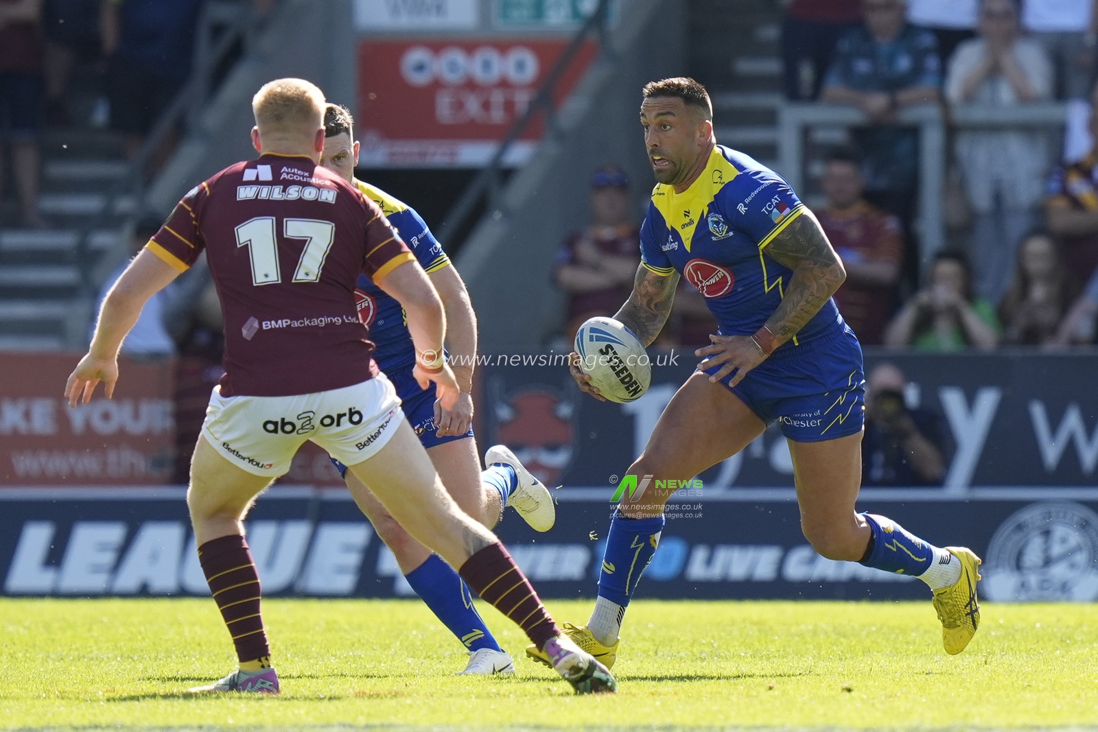 Paul Vaughan of Warrington Wolves runs at the Huddersfield Giants defence during the Betfred Challenge Cup Semi-Final match Huddersfield Giants vs Warrington Wolves at Totally Wicked Stadium, St Helens, United Kingdom, 19th May 2024

(Photo by Steve Flynn/News Images)