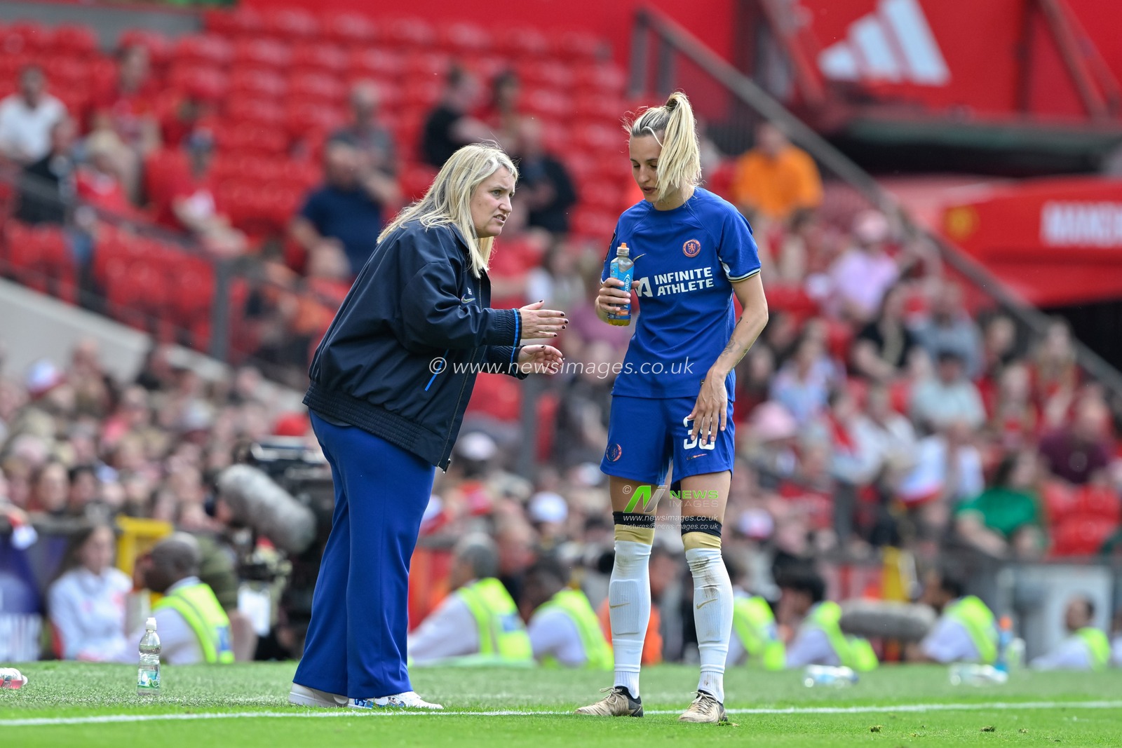 Emma Hayes manager of Chelsea Women speaks with Aggie Beever-Jones of Chelsea Women, during the The FA Women's Super League match Manchester United Women vs Chelsea FC Women at Old Trafford, Manchester, United Kingdom, 18th May 2024

(Photo by Cody Froggatt/News Images)