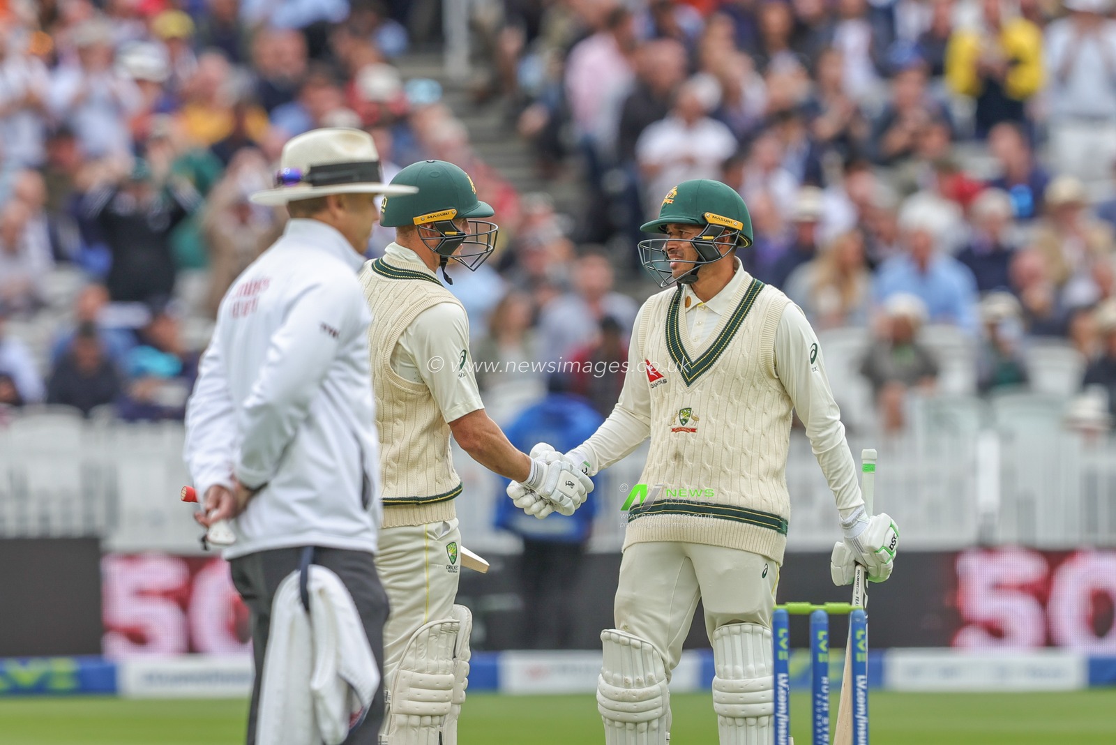 Marnus Labuschagne of Australia shakes hands with Usman Khawaja of Australia as he celebrates a half century (50 runs) during the LV= Insurance Ashes Test Series Second Test Day 3 England v Australia at Lords, London, United Kingdom, 30th June 2023

(Photo by Mark Cosgrove/News Images)