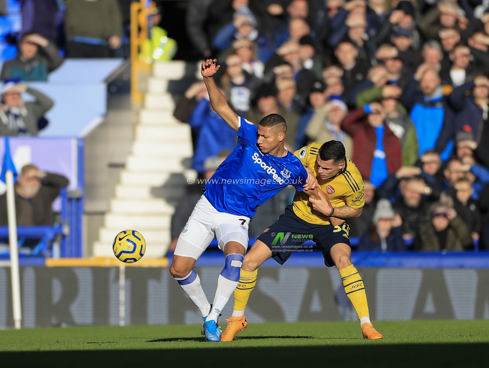 21st December 2019, Goodison Park, Liverpool, England; Premier League, Everton v Arsenal : Richarlison (7) of Everton and Granit Xhaka (34) of Arsenal challenge for the ball
Credit: Conor Molloy/News Images
