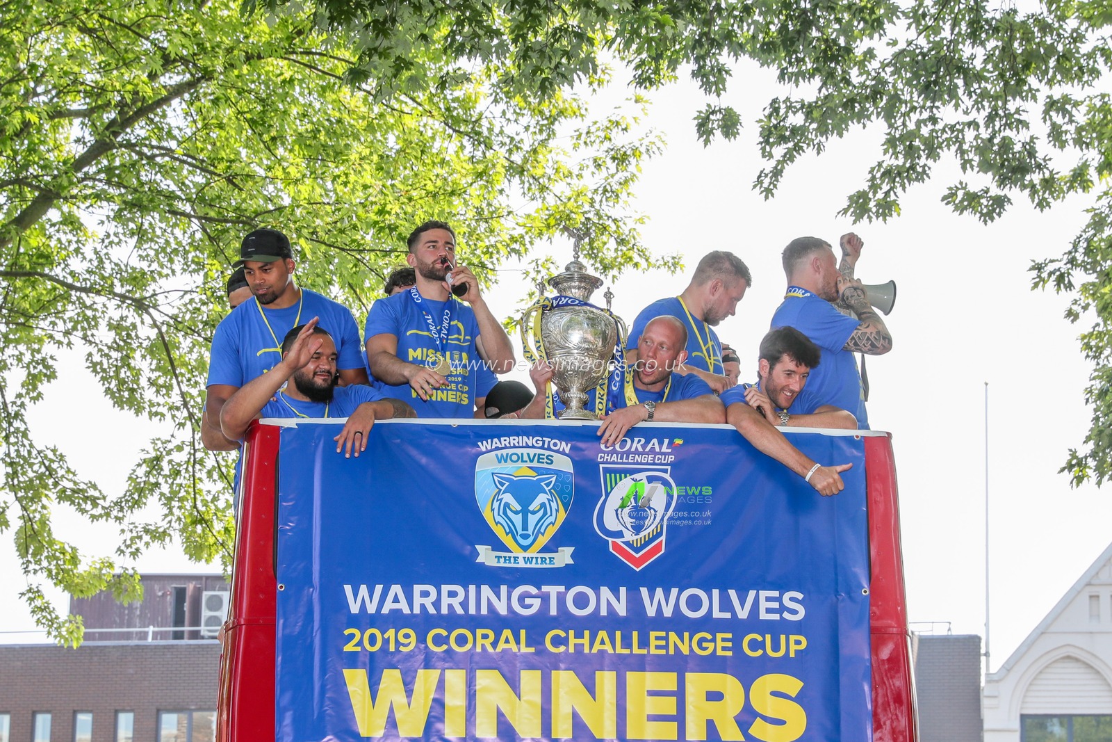 26th August 2019 , Open Top Bus, Town Hall, ,Warrington England ; 2019 Coral Challenge Cup Final open top bus tour and Town Hall celebrations ; Chris Hill (8) of Warrington Wolves holds the Challenge Cup as Warrington arrive at the Town Hall 

Credit: Mark Cosgrove/News Images