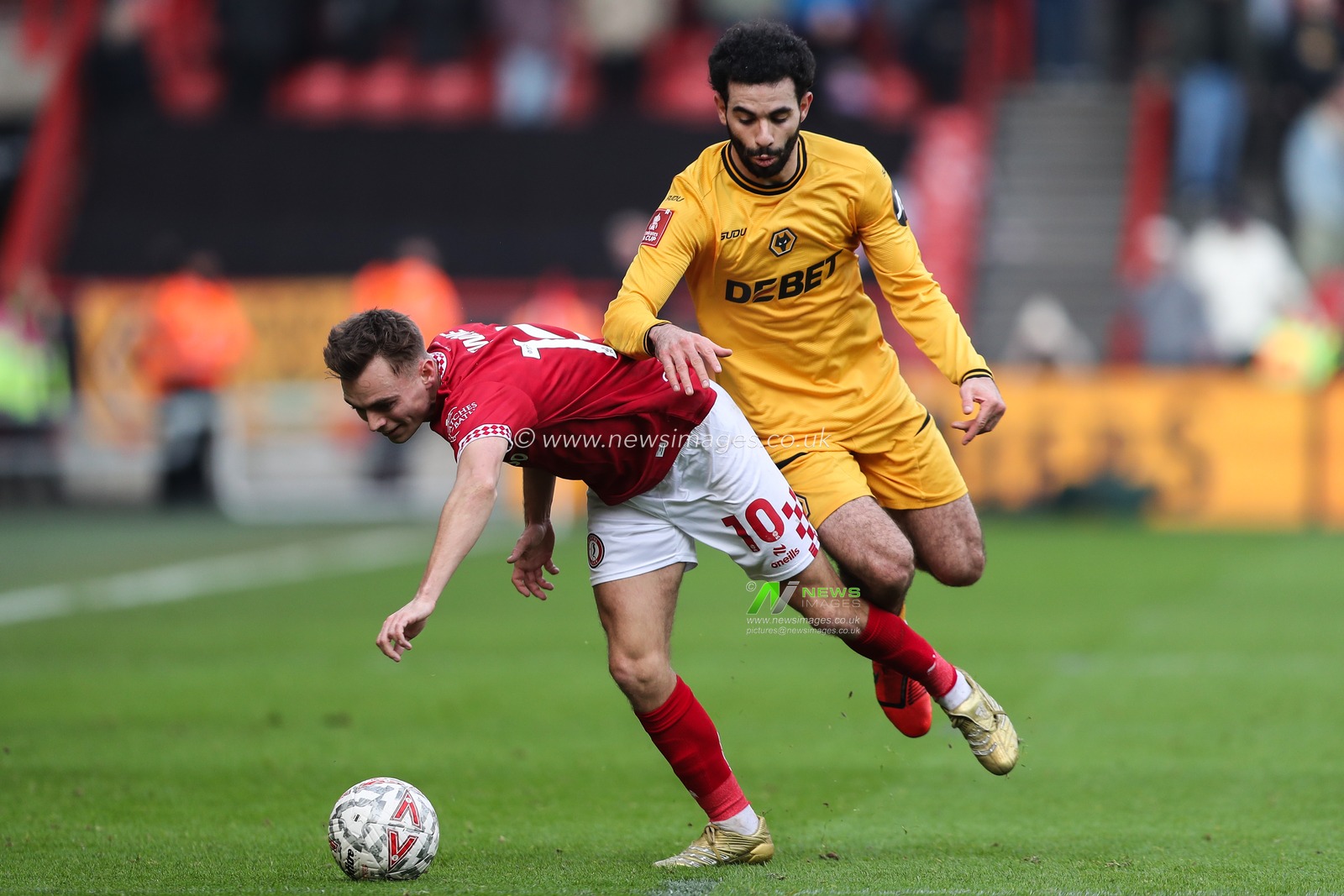 Rayan AÃ¯t-Nouri of Wolverhampton Wanderers fouls Scott Twine of Bristol City during the Emirates FA Cup 3rd Round match Bristol City vs Wolverhampton Wanderers at Ashton Gate, Bristol, United Kingdom, 11th January 2025

(Photo by Gareth Evans/News Images)