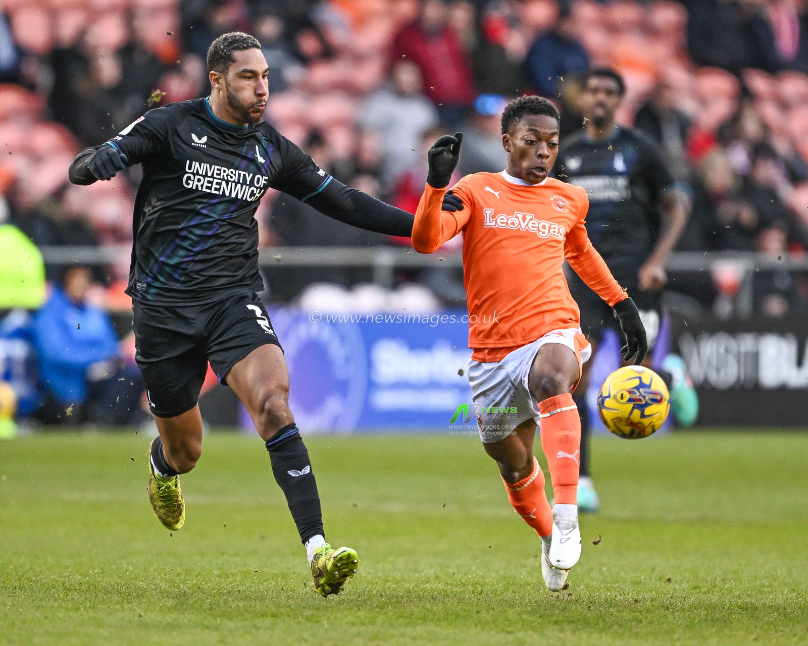 Karamoko DembÃ©lÃ© of Blackpool battles for the ball with Terell Thomas of Charlton Athletic during the Sky Bet League 1 match Blackpool vs Charlton Athletic at Bloomfield Road, Blackpool, United Kingdom, 27th January 2024

(Photo by Craig Thomas/News Images)
