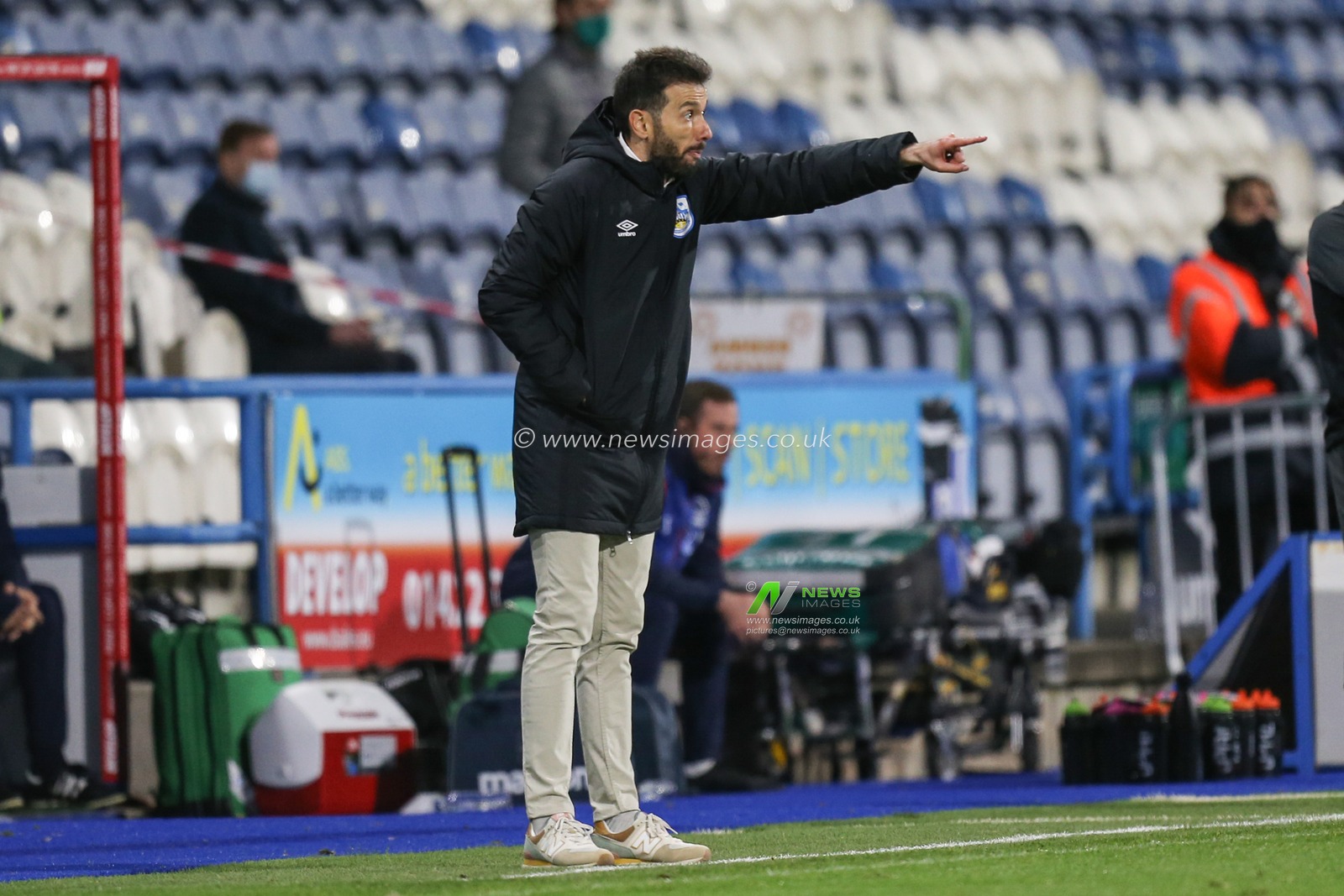 Carlos Corberan manager of Huddersfield Town gives orders to his players