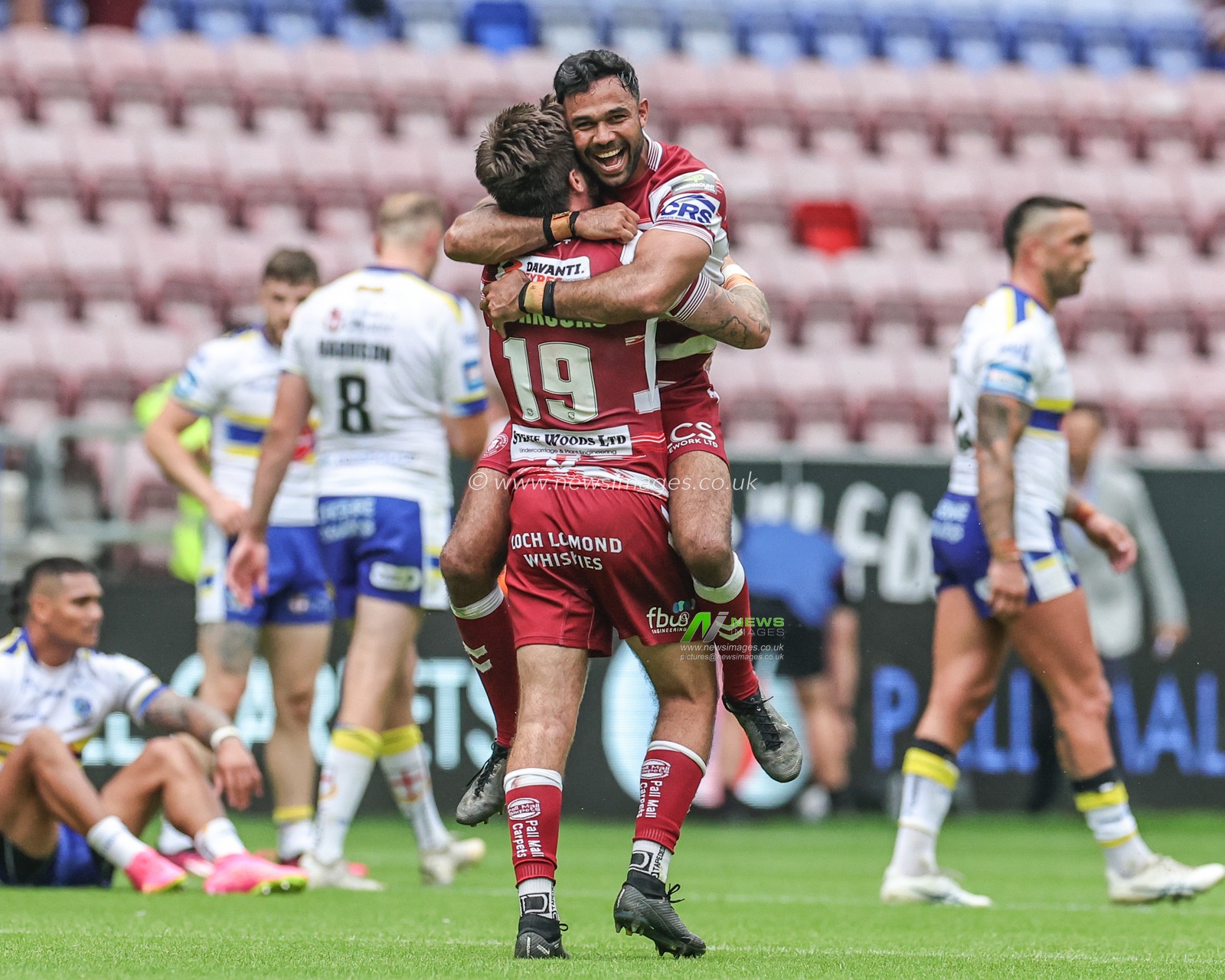 Bevan French #2 of Wigan Warriors jumps up on Joe Shorrocks #19 of Wigan Warriors as they celebrate progressing to the semi-final during the Betfred Challenge Cup Quarter-Final match Wigan Warriors vs Warrington Wolves at DW Stadium, Wigan, United Kingdom, 18th June 2023

(Photo by Mark Cosgrove/News Images)