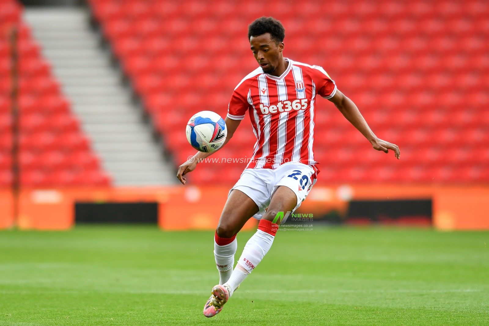 Tashan Oakley-Boothe (20) of Stoke City looks to control the ball