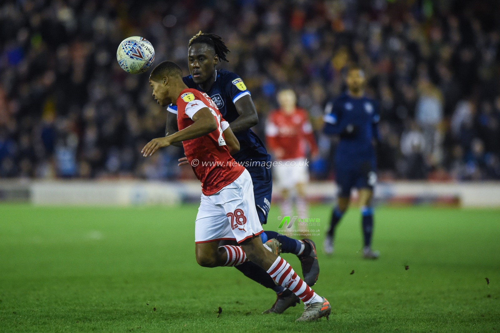 11th January 2020, Oakwell, Barnsley, England; Sky Bet Championship, Barnsley v Huddersfield Town : Trevor Chalabah (8) of Huddersfield Town and Elliot Jorge Simoes Inacio (28) of Barnsley FC challenge for the ball.

Credit: Dean Williams/News Images