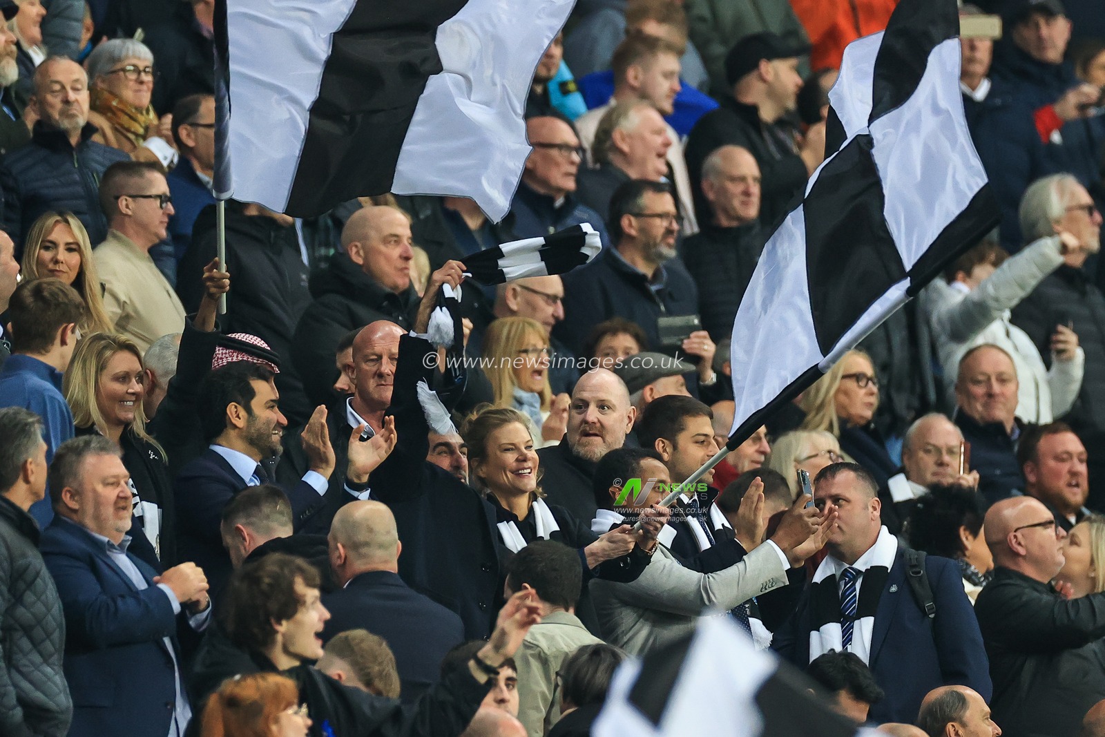 Amanda Staveley Newcastle owner waves a flag as she celebrates the win