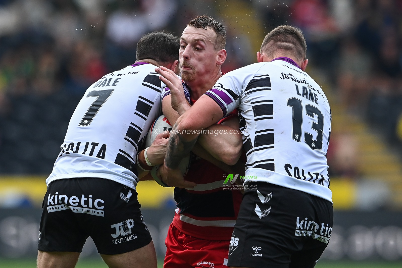 Frankie Halton #27 of Hull KR is tackled by Luke Gale #7 and Jordan Lane #13 of Hull FC during the Betfred Super League match Hull FC vs Hull KR at MKM Stadium, Hull, United Kingdom, 3rd September 2022

(Photo by Craig Thomas/News Images)