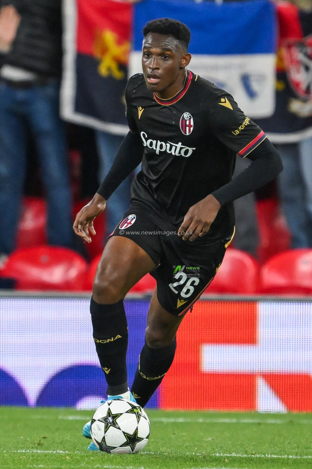 Jhon LucumÃ­ of Bologna runs with the ball during the UEFA Champions League  - League Stage match Liverpool vs Bologna at Anfield, Liverpool, United Kingdom, 2nd October 2024

(Photo by Craig Thomas/News Images)