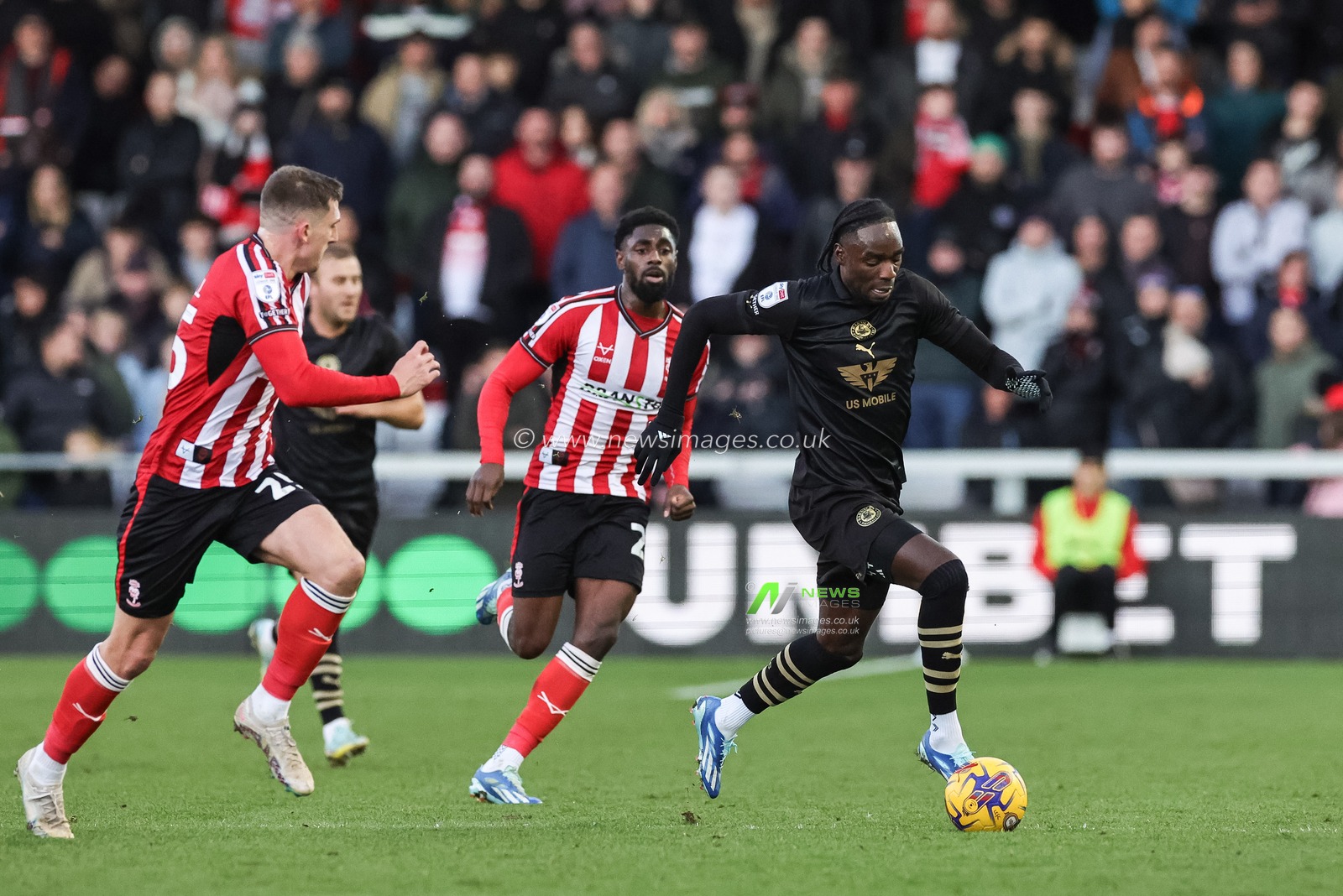 Devante Cole #44 of Barnsley breaks with the ball during the Sky Bet League 1 match Lincoln City vs Barnsley at Gelder Group Sincil Bank Stadium, Lincoln, United Kingdom, 25th November 2023

(Photo by Mark Cosgrove/News Images)