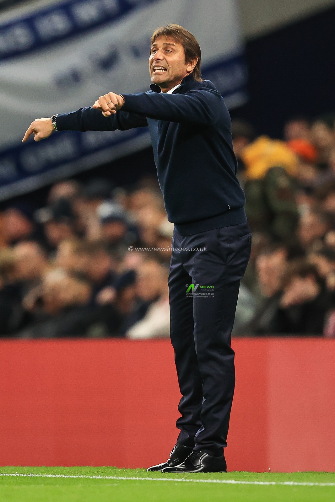 Antonio Conte manager of Tottenham Hotspur gives his team instructions