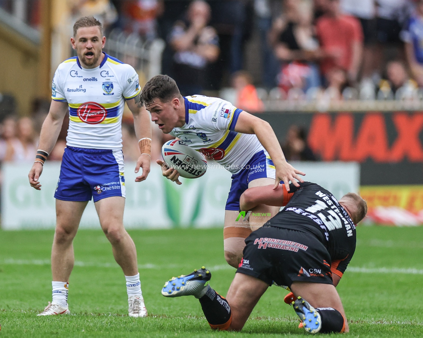 Josh Thewlis #2 of Warrington Wolves is tackled by Joe Westerman #13 of Castleford Tigers during the Betfred Super League Round 16 match Castleford Tigers vs Warrington Wolves at The Mend-A-Hose Jungle, Castleford, United Kingdom, 23rd June 2023

(Photo by Mark Cosgrove/News Images)