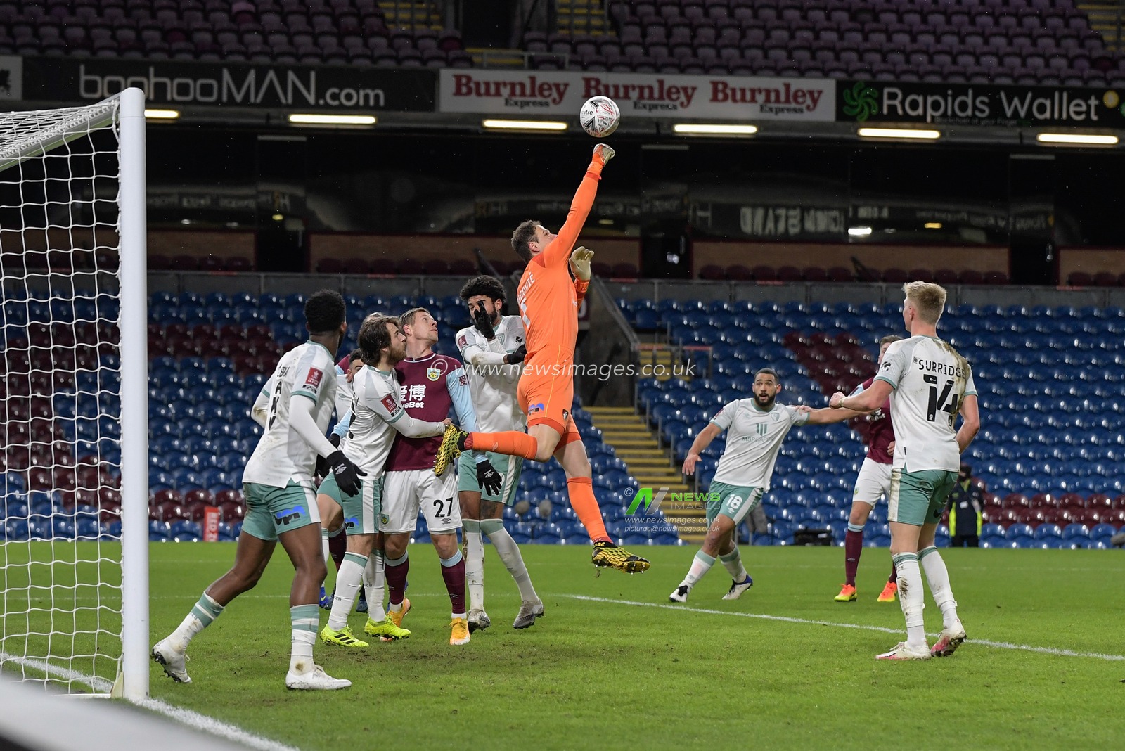 Asmir Begovic #1 of Bournemouth punches the ball clear