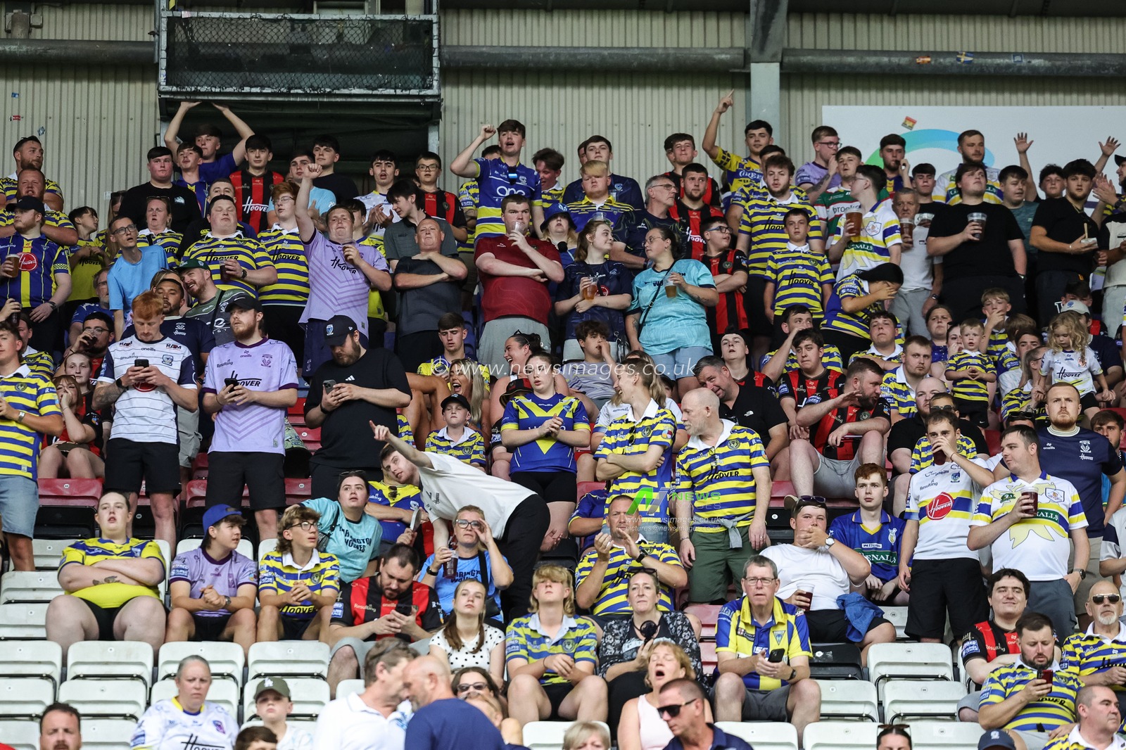 Warrington fans take to their seats during the Betfred Super League round 18 match Wigan Warriors vs Warrington Wolves at The Brick Community Stadium, Wigan, United Kingdom on 10 July 2026

(Photo by Mark Cosgrove/News Images)