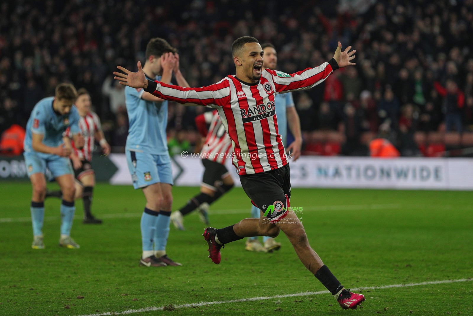 Iliman Ndiaye #29 of Sheffield United celebrates Billy Sharp #10 of Sheffield United goal to make it 2-1 during the Emirates FA Cup Fourth Round Replay match Sheffield United vs Wrexham at Bramall Lane, Sheffield, United Kingdom, 7th February 2023

(Photo by James Heaton/News Images)