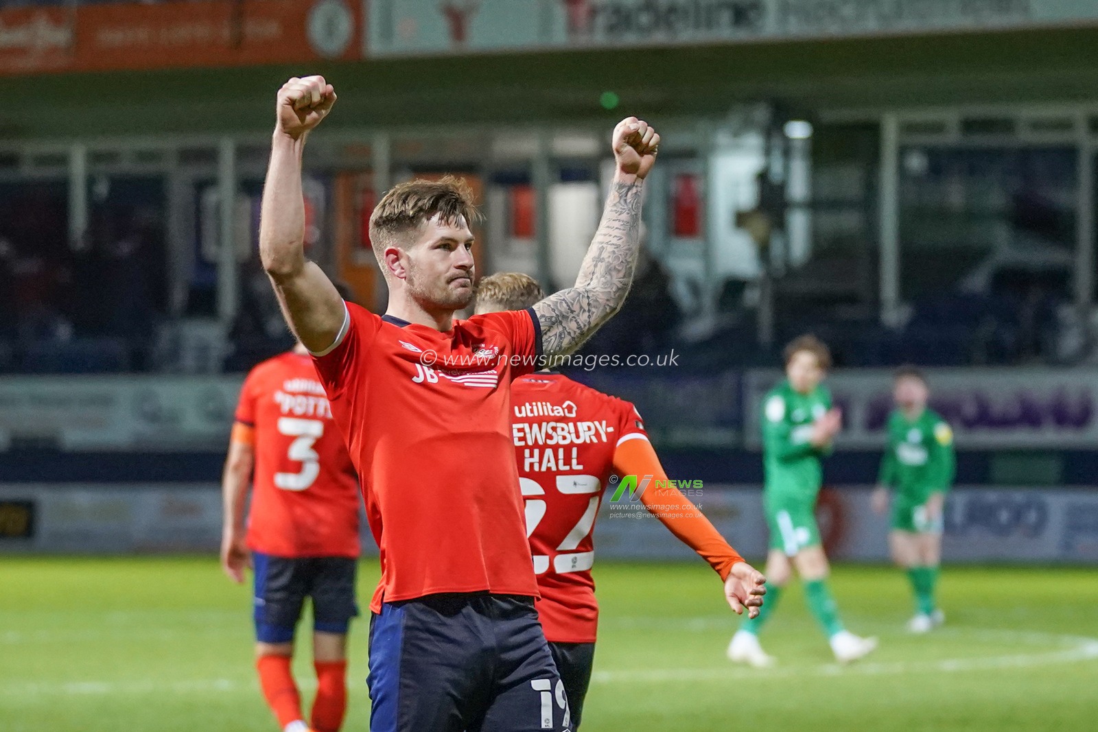 James Collins of Luton Town celebrates hi hat-trick making it 3-0