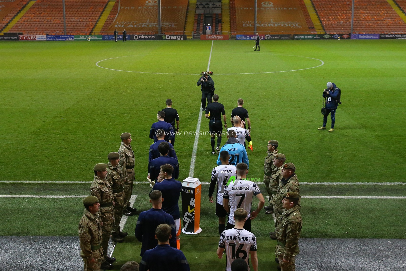 Members of the Armed Forces give the players a guard of honour during the Bristol Street Motors Trophy match Blackpool vs Morecambe at Bloomfield Road, Blackpool, United Kingdom, 14th November 2023

(Photo by Gareth Evans/News Images)