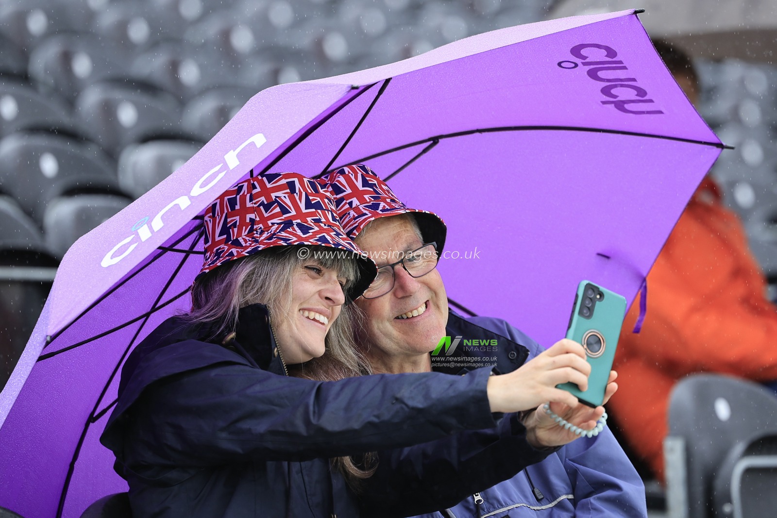 Cricket fans sheltering from the drizzle ahead of the LV= Insurance Ashes Test Series Fourth Test Day Five match England vs Australia at Old Trafford, Manchester, United Kingdom, 23rd July 2023

(Photo by Conor Molloy/News Images)