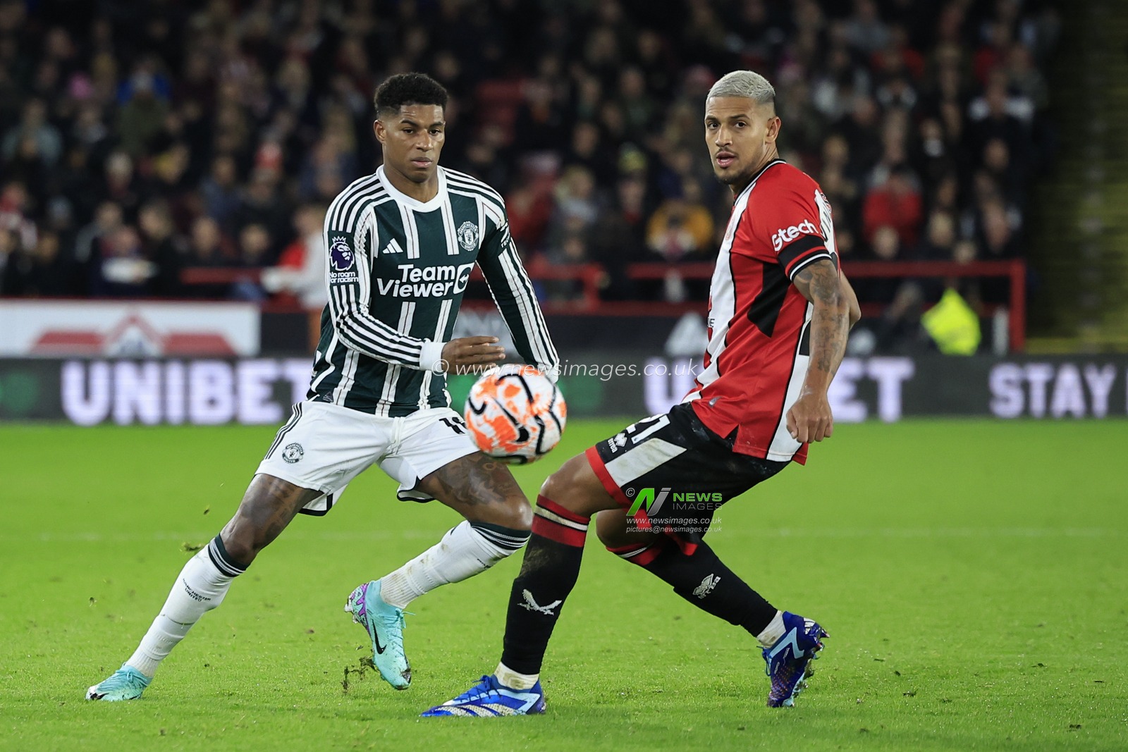 Marcus Rashford #10 of Manchester United  passes the ball beyond Vinicius Souza #21 of Sheffield United during the Premier League match Sheffield United vs Manchester United at Bramall Lane, Sheffield, United Kingdom, 21st October 2023

(Photo by Conor Molloy/News Images)