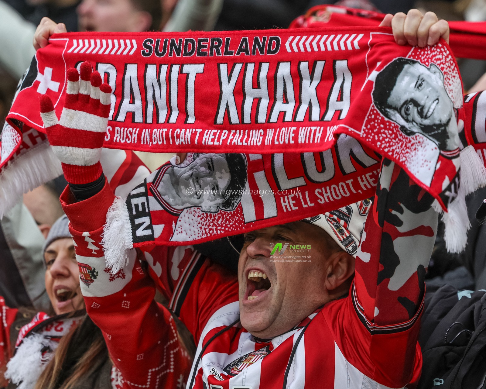 A fans holds a Granit Xhaka of Sunderland scarf during the Premier League match Sunderland vs Leeds United at Stadium Of Light, Sunderland, United Kingdom, 28th December 2025

(Photo by Alfie Cosgrove/News Images)

*** GER AUT SUI OUT ***