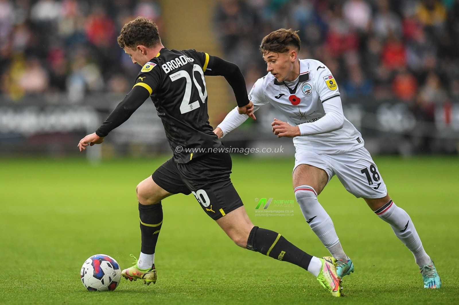 Nathan Broadhead #20 of Wigan Athletic takes on Luke Cundle #18 of Swansea City during the Sky Bet Championship match Swansea City vs Wigan Athletic at Swansea.com Stadium, Swansea, United Kingdom, 5th November 2022

(Photo by Mike Jones/News Images)