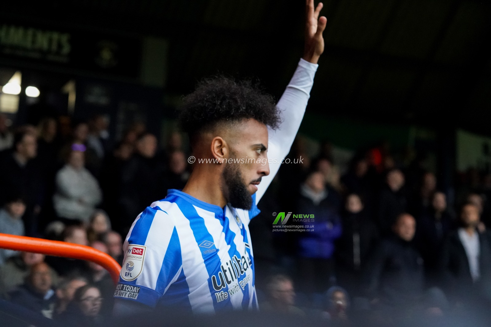 Sorba Thomas #16 of Huddersfield Town takes a corner kick