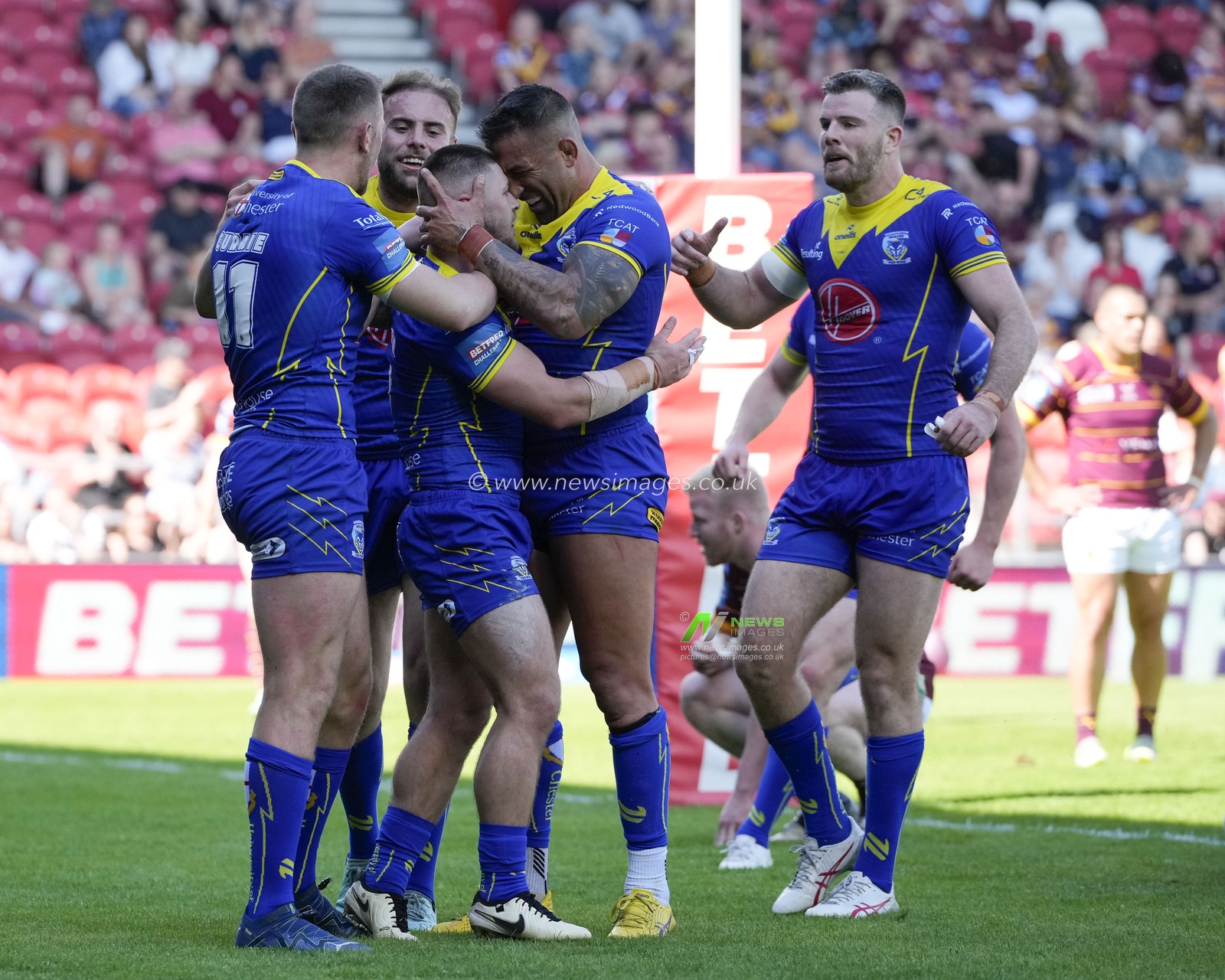 Paul Vaughan of Warrington Wolves celebrates with Danny Walker of Warrington Wolves after he drives over to score a try during the Betfred Challenge Cup Semi-Final match Huddersfield Giants vs Warrington Wolves at Totally Wicked Stadium, St Helens, United Kingdom, 19th May 2024

(Photo by Steve Flynn/News Images)